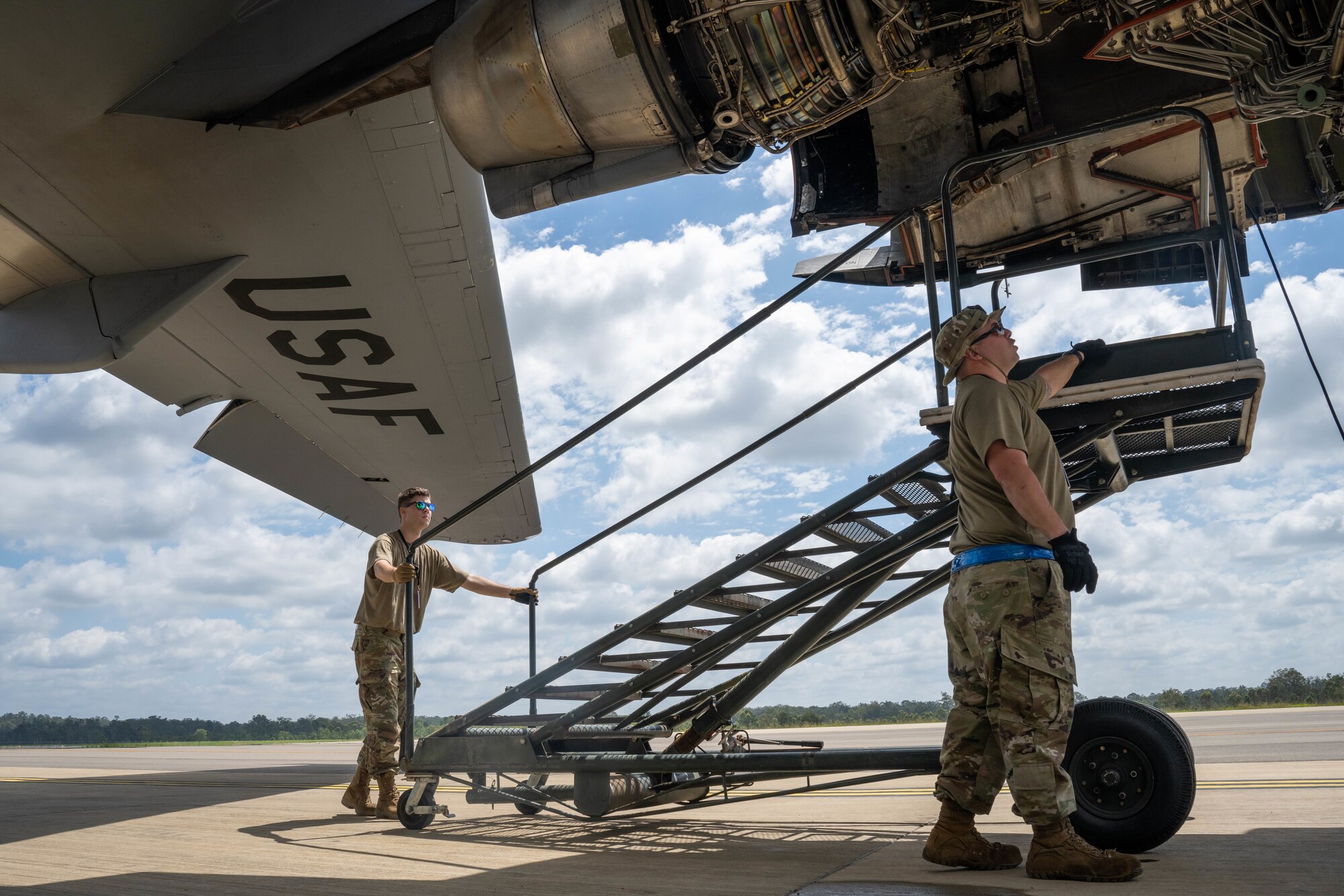 U.S. Air Force Staff Sgt. Aaron Kamphouse and Tech. Sgt. Anthony Goodman inspect the engine of a C-17 Globemaster III during Exercise Global Dexterity 23-2 at Royal Australian Air Force Base Amberley, Nov. 29, 2023. The exercise demonstrates the key partnership and interoperability between the U.S. and Australia that allows continued security and stability in the Indo-Pacific region. (U.S. Air Force photo by Senior Airman Makensie Cooper)