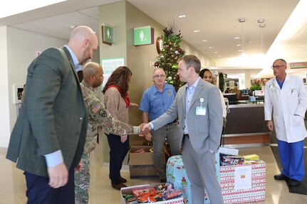 Staff members from the 85th U.S. Army Reserve Support Command, and the Defense Contract Management Agency-Chicago meet with staff from the Northwest Community Hospital in Arlington Heights, Illinois, December 12, 2023.