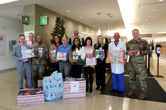 Staff from the 85th U.S. Army Reserve Support Command, and the Defense Contract Management Agency-Chicago pause for a photo with staff from the Northwest Community Hospital in Arlington Heights, Illinois, December 12, 2023.