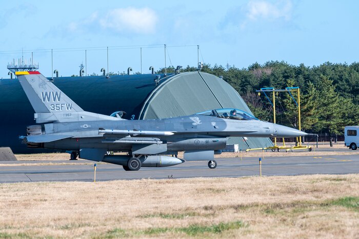 A U.S. Air Force pilot taxis an F-16 Fighting Falcon during a PAC WEASEL Exercise at Misawa Air Base, Japan, Dec. 8, 2023.
