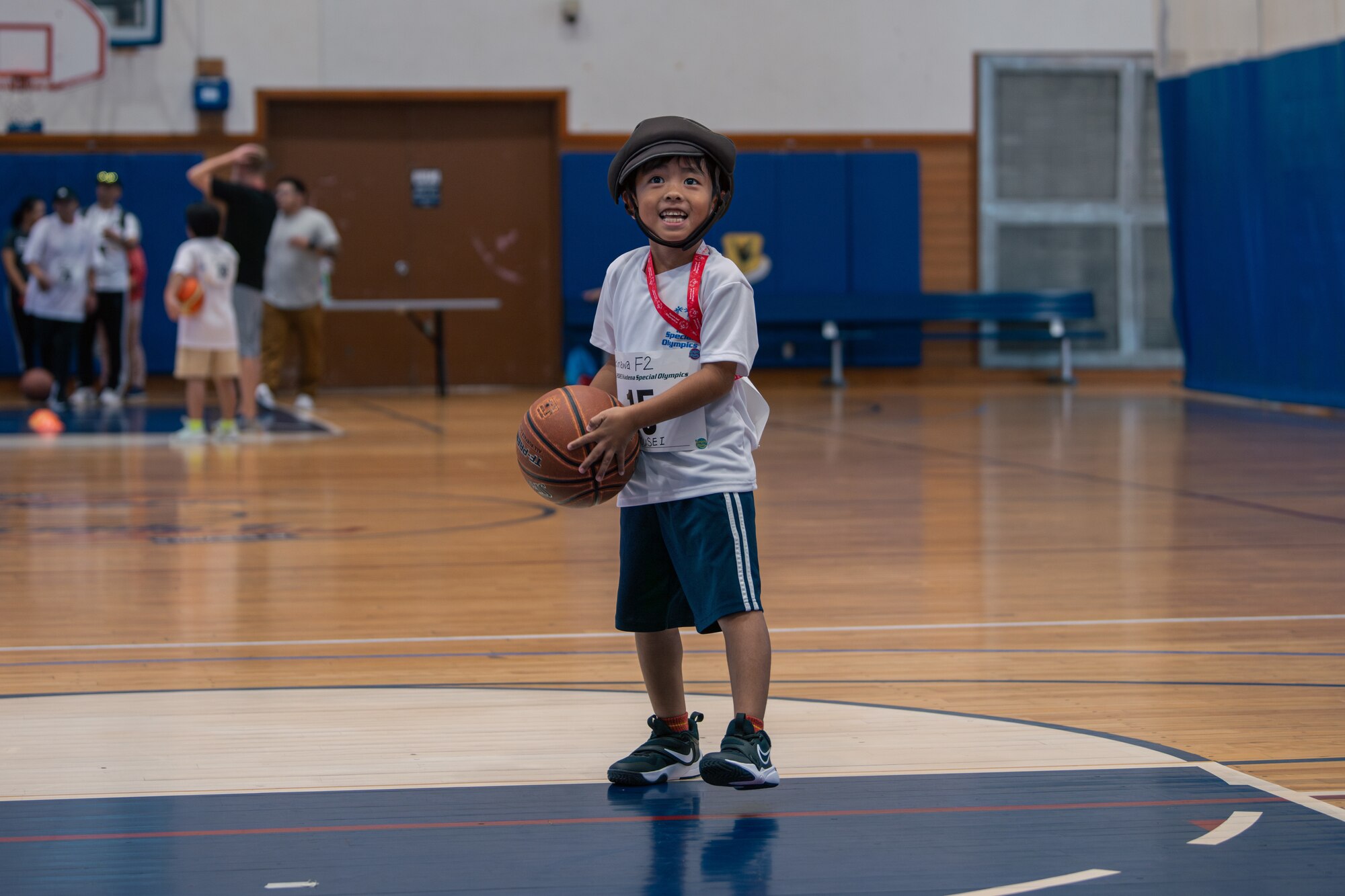 An athlete shoots a basketball.
