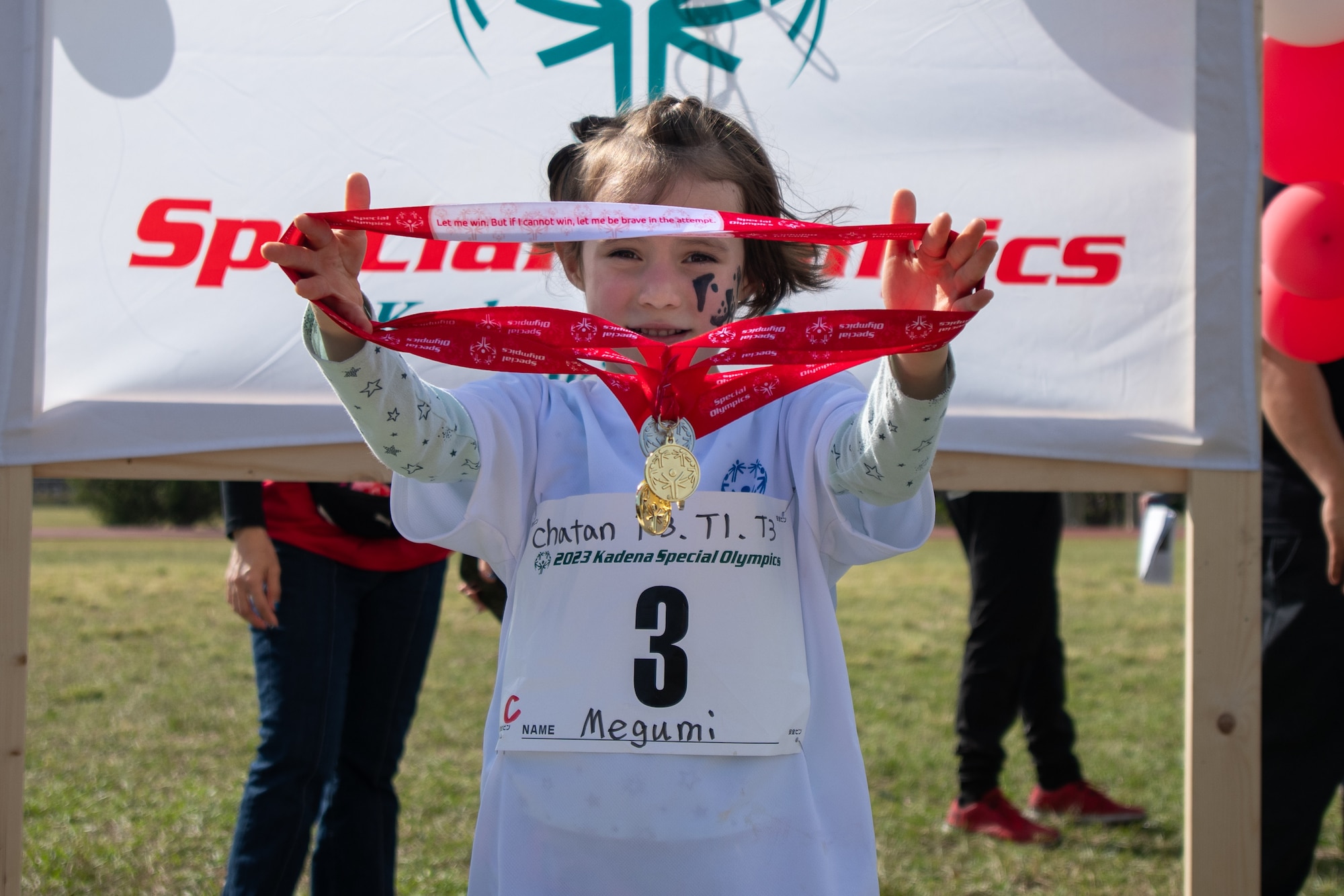 An athlete displays medals.