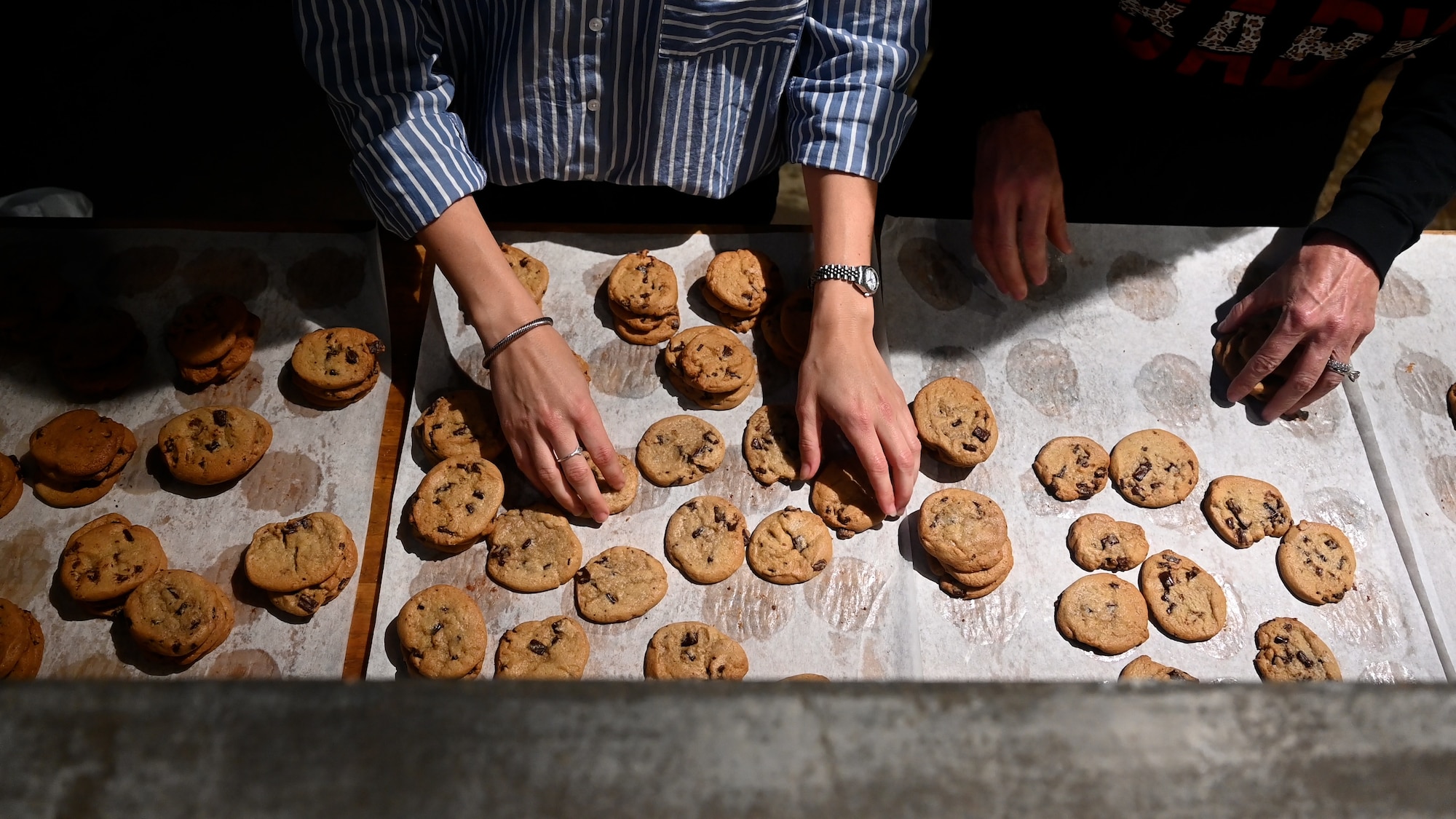 The community of San Angelo participates in the annual Cookie Caper to deliver cookies to military members at Goodfellow Air Force Base, Dec. 4, 2023. About 18,000 cookies were baked and distributed to students and permanent party residents who live in the dorms. (U.S. Air Force photo by Airman 1st Class Zach Heimbuch)