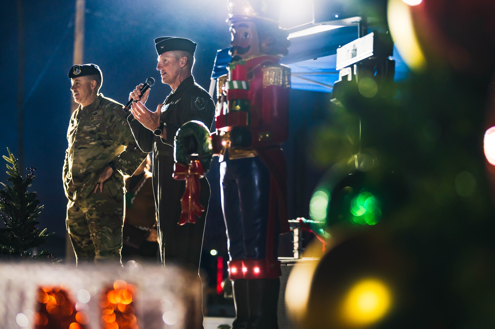 U.S. Air Force Brig. Gen. Jason Rueschhoff (right), 56th Fighter Wing commander, and Chief Master Sgt. Jason Shaffer (left), 56th Fighter Wing command chief, address Luke Air Force Base personnel and their families during a Holiday Magic event.
