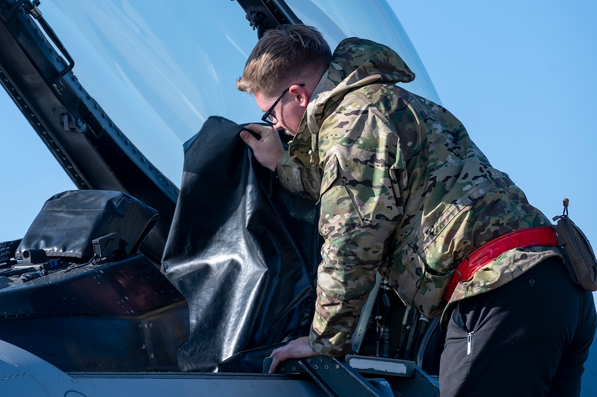 U.S. Air Force Airman 1st Class Donovan Wallace, 13th Fighter Generation Squadron crew chief, prepares an F-16 Fighting Falcon during a PAC WEASEL Exercise at Misawa Air Base, Japan, Dec. 8, 2023.