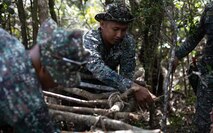 Philippine Marines with Marine Battalion Landing Teams 8 and 10 build a wooden shelter at a jungle shelter class during KAMANDAG 7 at Paredes Air Station, Philippines, Nov. 10, 2023. KAMANDAG is an annual Philippine Marine Corps and U.S. Marine Corps led exercise aimed at improving multinational readiness, relationships, and mutual capabilities in the advancement of a Free and Open Indo-Pacific. This year marks the seventh iteration of this exercise and includes participants from Japan, the Republic of Korea, and observers from the United Kingdom. (U.S. Marine Corps photo by Sgt. Jacqueline C. Parsons)