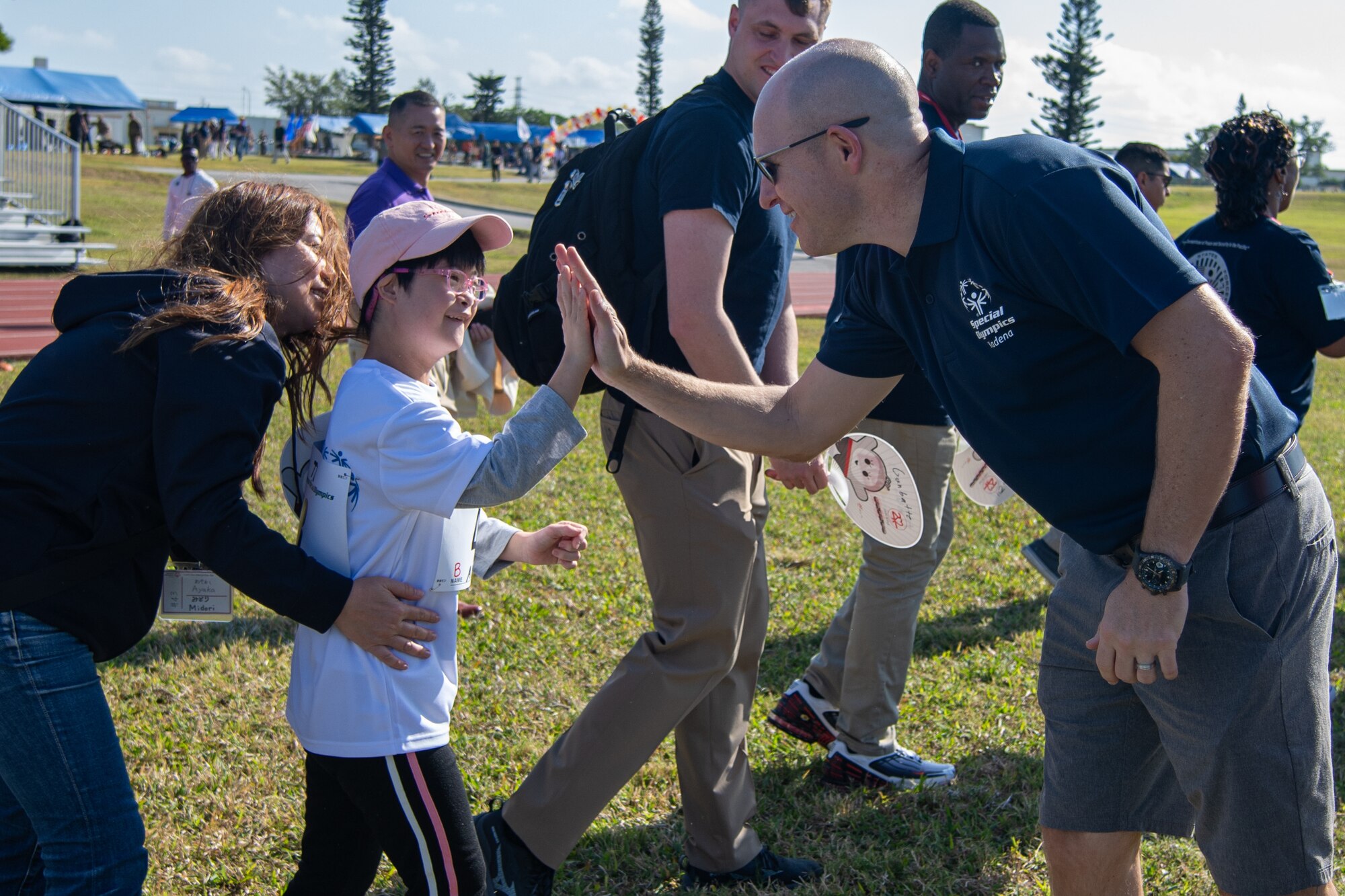 An Airman and athlete celebrate.