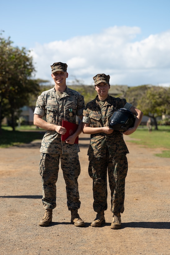 U.S. Marine Corps Cpl. Caleb Williams, left, and Lance Cpl. Anahi Anaya pose for a photo after a ceremony on Marine Corps Base Hawaii, Dec. 8, 2023. The ceremony was to award Williams with the U.S. Navy and Marine Corps Commendation Medal for heroic actions that saved Anaya’s life after a motor incident. “If he wasn’t there, I would not be here today,” said Anaya. “We didn’t even know each other that well. It’s crazy how strangers can become family in an instant.” Williams used medical aid knowledge and skills he received since joining the Marine Corps. “When the accident happened, I moved without thinking and relied on the training we do constantly as Marines,” said Williams. And referring to his comrades in 3d Littoral Combat Team, Williams said, “I did what any of you would have done if you were in my place, I know that for sure.” Williams, a native of Salisbury, N.C., is an infantry rifleman with 3d LCT, 3d Marine Littoral Regiment, 3d Marine Division. Anaya, a native of Momence, Ill., is an administrative specialist with 3d Marine Littoral Regiment. (U.S. Marine Corps photo by Sgt. Jacqueline C. Parsons)