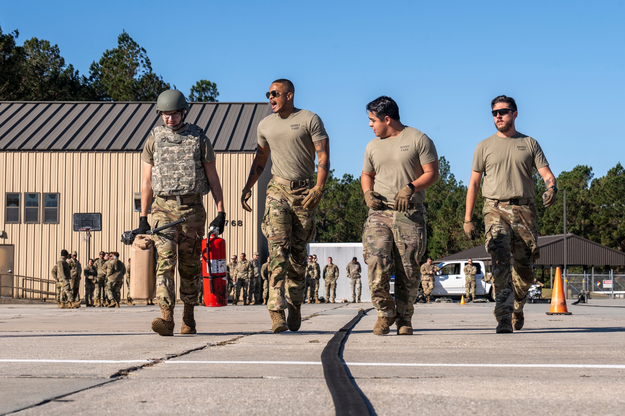 U.S. Air Force Airman 1st Class Andrew Wright, left, 23rd Logistic Readiness Squadron distribution operator, tries out for the forward area refueling point team