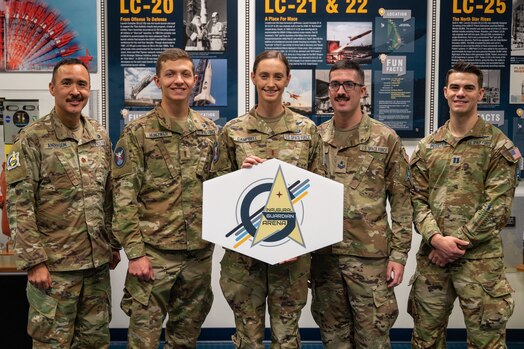  Members of the team from Delta 8 pose for a photo during the Guardian Arena event at Cape Canaveral Space Force Station, Florida, Dec. 10, 2023. Teams of five members, consisting of U.S. Space Force officers, enlisted, government civilians, and USSF assigned Airmen, participated in a combined operation consisting of knowledge tests, problem solving exercises, and a physical challenge. The inaugural Guardian Arena instilled esprit de corps and provided an opportunity to dive into operationalizing the Guardian Ideal, Guardian Spirit, and Guardian Commitment. (U.S. Space Force photo by Airman 1st Class Spencer Contreras)