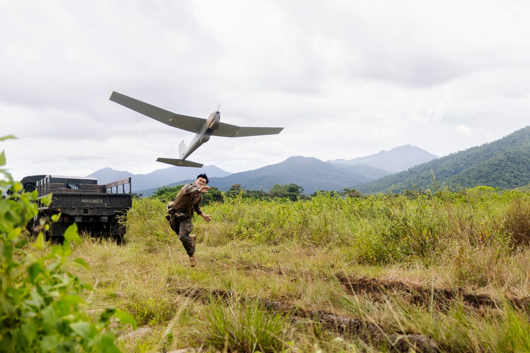 U.S. Marine Corps Sgt. Vincent Tran, a communications chief with Marine Rotational Force-Southeast Asia, I Marine Expeditionary Force, launches an RQ-20B small unmanned aerial system at a sUAS subject matter expert exchange during KAMANDAG 7 in Iwahig, Palawan, Philippines, Nov. 13, 2023. Marines from the U.S. and the Philippines shared their preferred methods of sUAS and how they employ these systems in the greater scope of warfare. KAMANDAG is an annual Philippine Marine Corps and U.S. Marine Corps-led exercise aimed at improving multinational readiness and mutual capabilities in the advancement of a Free and Open Indo-Pacific. This year marks the seventh iteration of this exercise and includes participants from Japan, the Republic of Korea, and observers from the United Kingdom. MRF-SEA is a Marine Corps Forces Pacific operational model that involves exchanges with subject matter experts, promotes security goals with Allies and Partners, and positions I MEF forces west of the International Date Line.