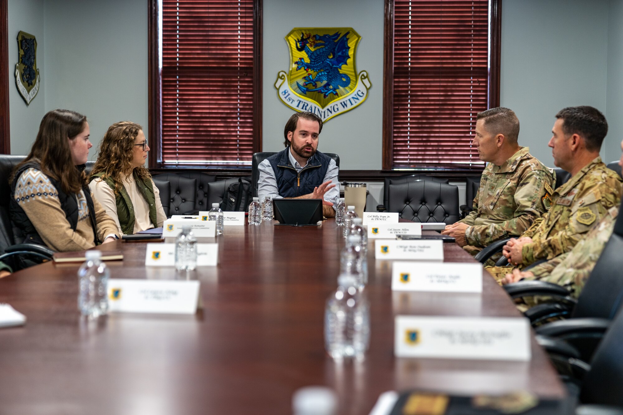 Members of the Senate Armed Services Committee receive a welcome brief at Keesler Air Force Base, Mississippi, Dec. 6, 2023.