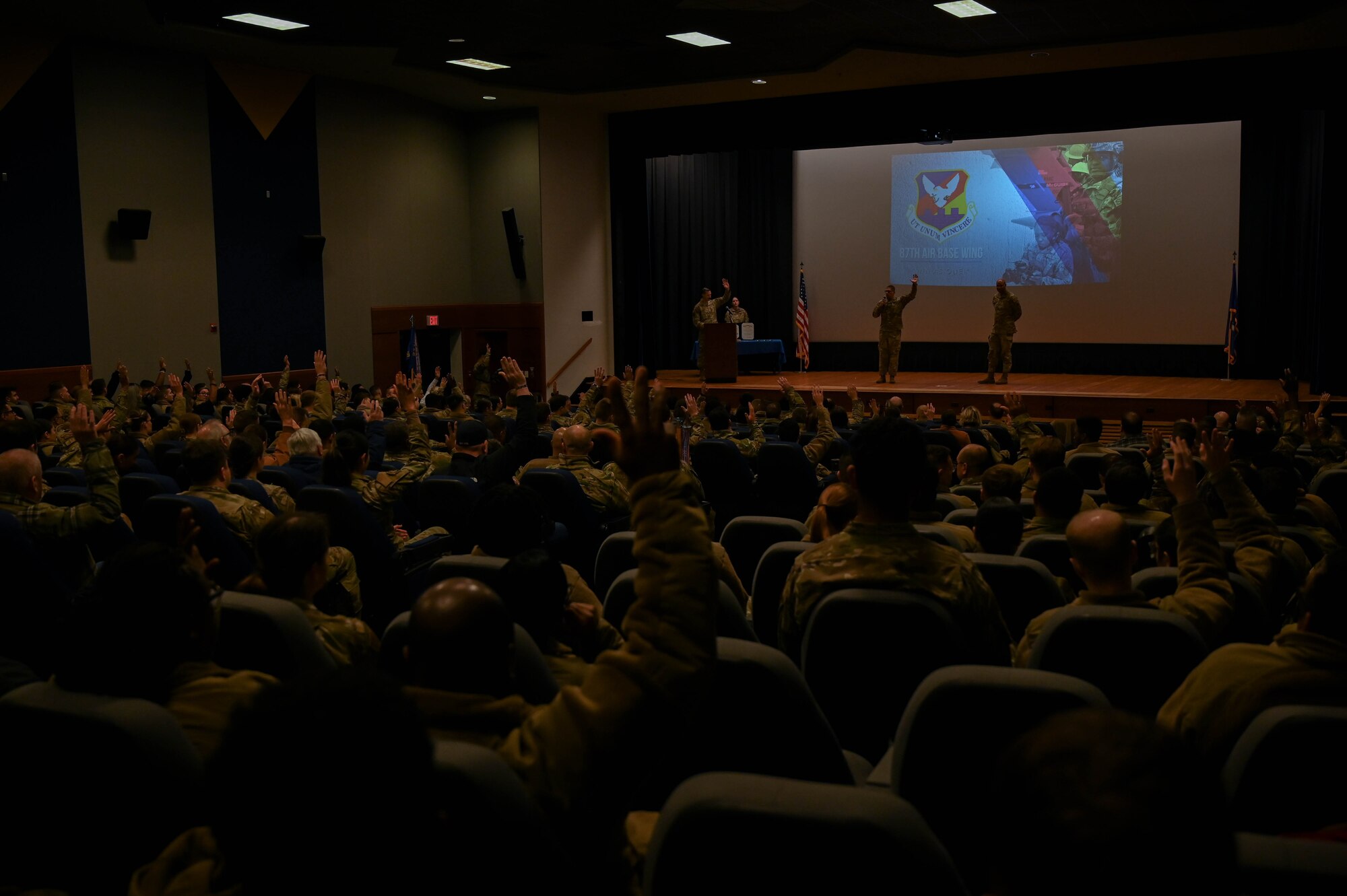 U.S. Air Force Col. Anthony L. Smith, Joint Base McGuire-Dix-Lakehurst commander and the 87th Air Base Wing commander, hosts a commanders call for members of the 87th ABW at JB MDL, N.J., Dec. 12, 2023. The commander's call highlighted recent accomplishments, the Warrior Connect program and presented awards to members from the 87th ABW. (U.S. Air Force Photo by Second Lieutenant Alexis Kula)
