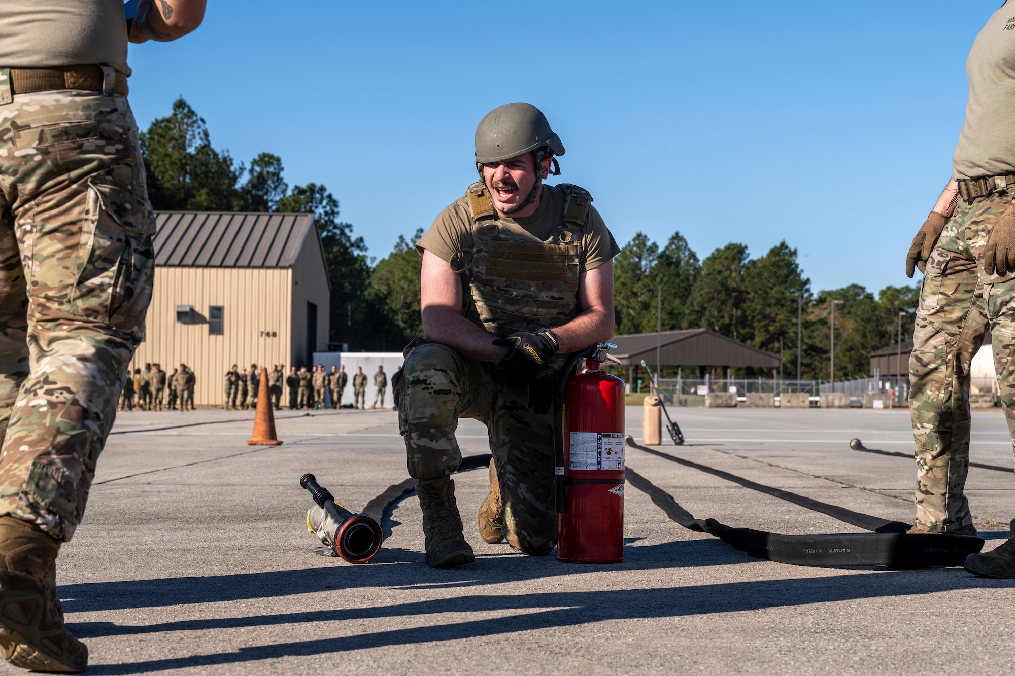 U.S. Air Force Airman 1st Class Broc Harris, 23rd Logistic Readiness Squadron supply, takes a knee during the forward area refueling point team tryout
