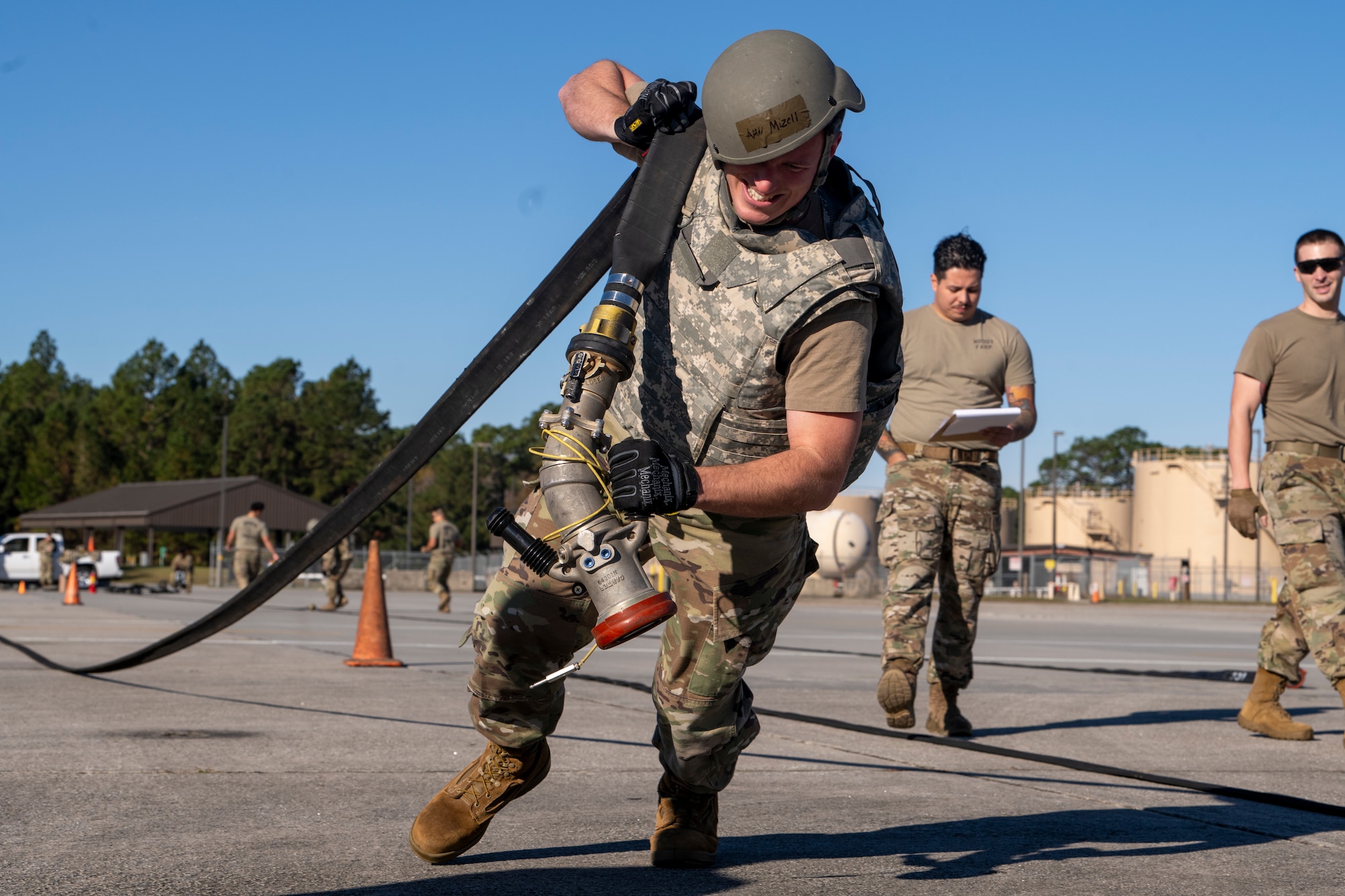 U.S. Air Force Tech. Sgt. Christopher Hattendorf, 23rd Logistics Readiness Squadron fuels knowledge operations, pulls a hose during a forward area refueling point team tryout event