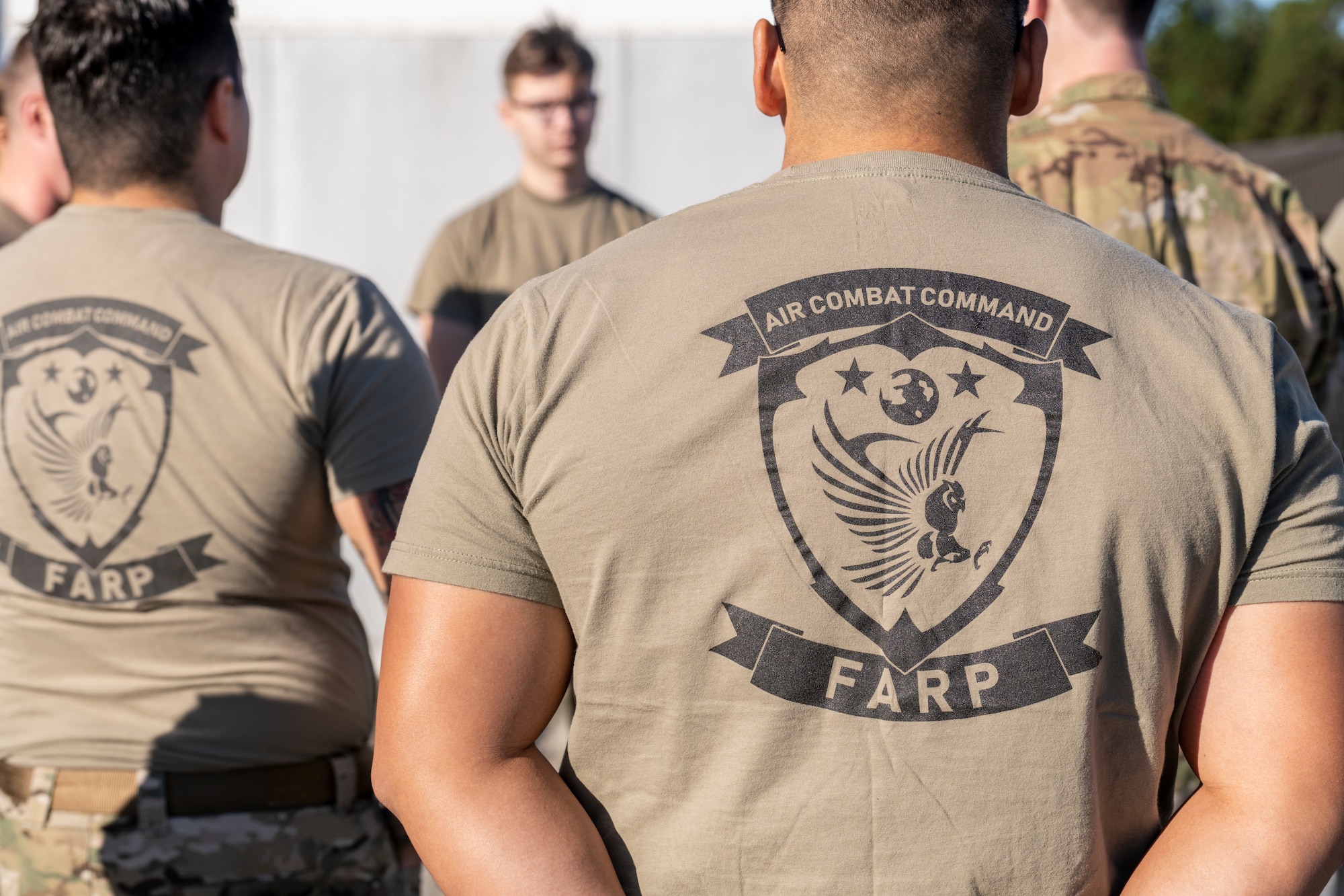 U.S. Air Force Airmen listen to a brief before a forward area refueling point team tryout event