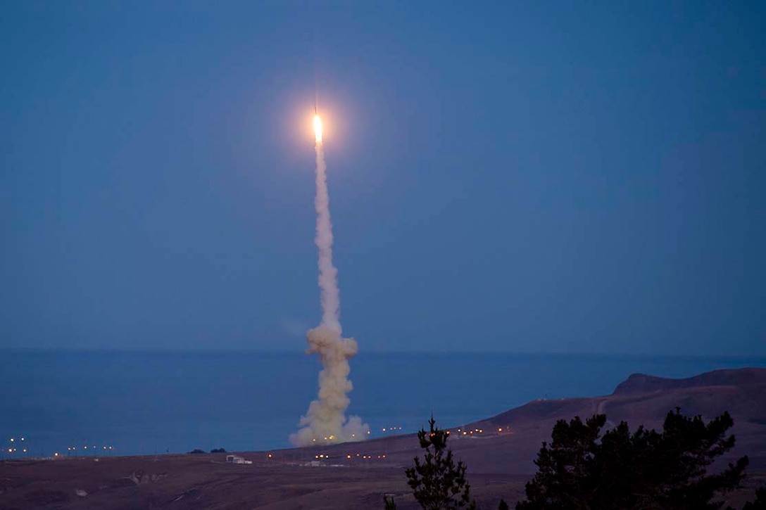 Smoke fills the air as a missile launches into the sky.