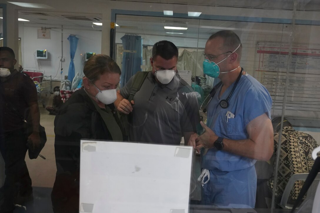 Members of the U.S. Army's 8th Forward Resuscitative and Surgical Detachment, 18th Medical Command, (2nd from the right) Port Moresby General Hospital Director of Medical Services Dr. Kone Sobi, and U.S. Army Maj. Levi Daugherty, trauma surgeon, Brooke Army Medical Center, pose for a group photo during the inaugural Papua New Guinea Trauma Rotation at Port Moresby General Hospital at Port Moresby, Papua New Guinea, Dec. 7, 2023. The Trauma Rotation follows the recent signing of the Defense Cooperation Agreement between the U.S. and Papua New Guinea; it is a first-of-its-kind engagement between the U.S. Army and Papua New Guinea, which mutually offers parties the a chance to exchange medical expertise and techniques in an austere environment. (U.S. Army photo by Sgt. 1st Class Timothy Hughes/Released)