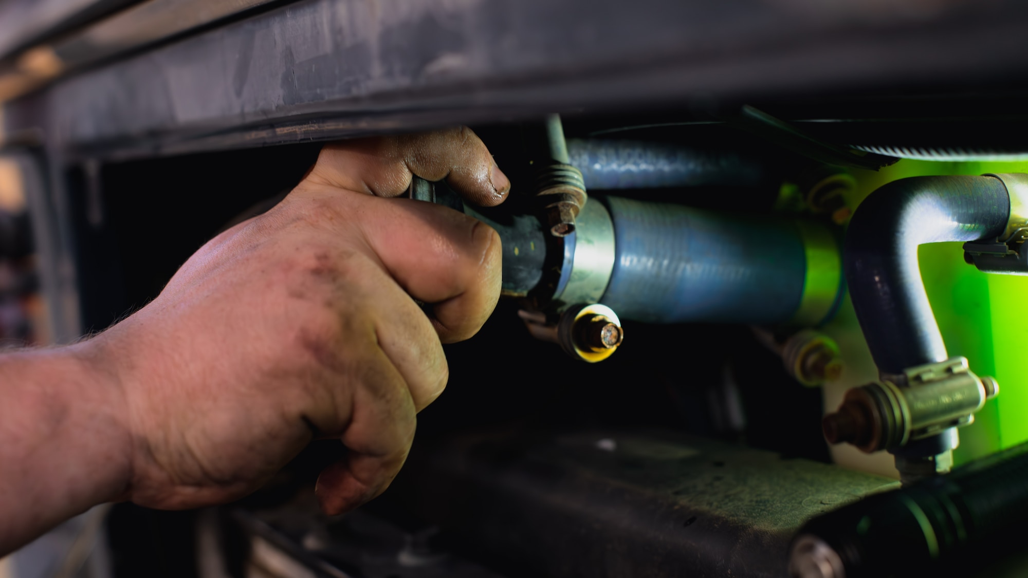 Airman refills coolant.