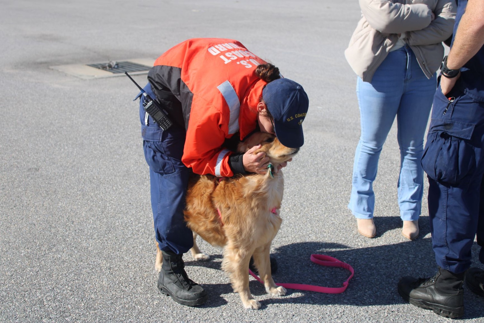 U.S. Coast Guard Petty Officer 1st Class Kalie Jones, a boatswain's mate assigned to the Coast Guard Cutter Dauntless (WMEC 624), greets her dog at the unit's return to homeport in Pensacola, Florida, Dec. 12, 2023. Dauntless deployed for 25 days in the Caribbean to conduct maritime safety and security operations.