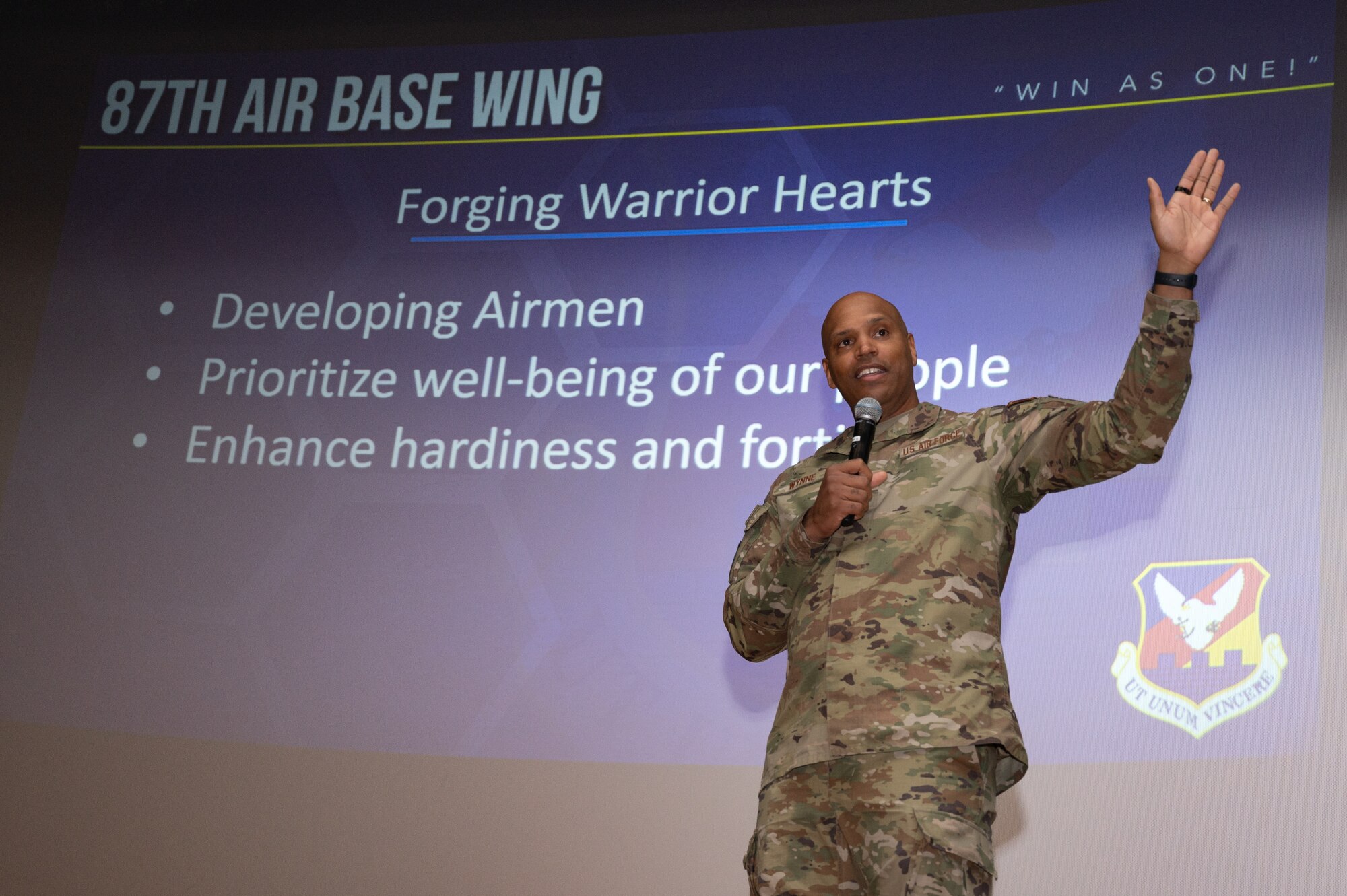 U.S. Air Force Col. Anthony L. Smith, Joint Base McGuire-Dix-Lakehurst commander and the 87th Air Base Wing commander, hosts a commanders call for members of the 87th ABW at JB MDL, N.J., Dec. 12, 2023. The commander's call highlighted recent accomplishments, the Warrior Connect program and presented awards to members from the 87th ABW.  (U.S. Air Force photo by Senior Airman Sergio Avalos)
