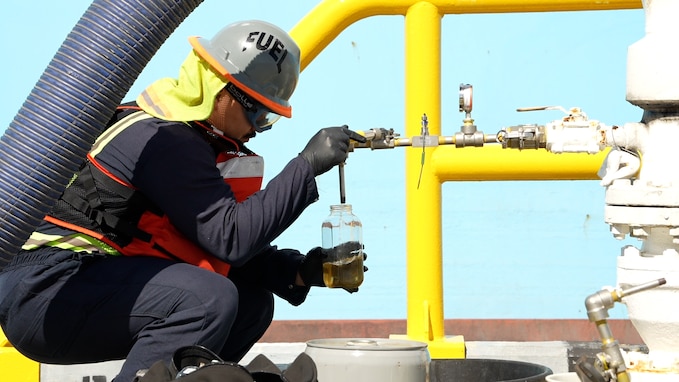 A member in support of Joint Task Force-Red Hill (JTF-RH) inspects the quality of fuel from the Red Hill Bulk Fuel Storage Facility (RHBFSF) at Joint Base Pearl Harbor-Hickam, Hawaii Dec. 7, 2023.