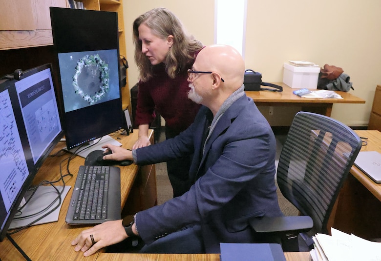 Director of the Laboratory of Archaeology at the University of Georgia and his wife Dr. Amanda, Operations Director, look at maps