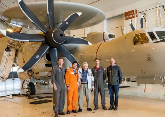 John Engelbrecht stands in front of an E-2D Hawkeye, flanked on the left by Lt. Cmdr. Bradley Roby and Ben Hashi, flight test engineer. To his right are Lt. Cmdr. David Chapelle and Engelbrecht’s son, Scott Engelbrecht. Scott Engelbrecht contacted Naval Air Systems Command and Naval Air Warfare Center Aircraft Division, who helped arrange a tour of Naval Air Station Patuxent River, Maryland.