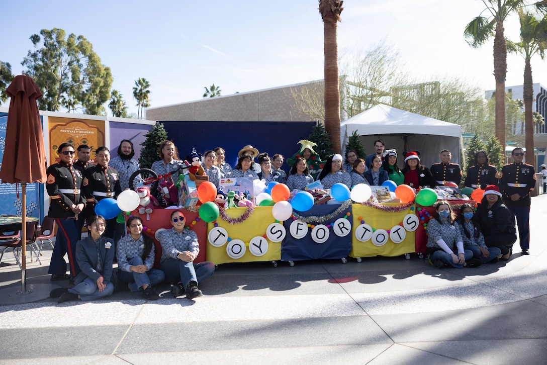 U.S. Marines with 2nd Battalion, 23rd Marine Regiment, 4th Marine Division, Marine Forces Reserve, and volunteers collect toys, books, and other gifts during Disneyland’s Toys for Tots Drive in Anaheim, California, Dec. 9, 2023. Toys for Tots is a year-round charity that provides toys, books, and games to economically disadvantaged children and families since 1947. (U.S. Marine Corps photo by Lance Cpl. Samantha Devine)