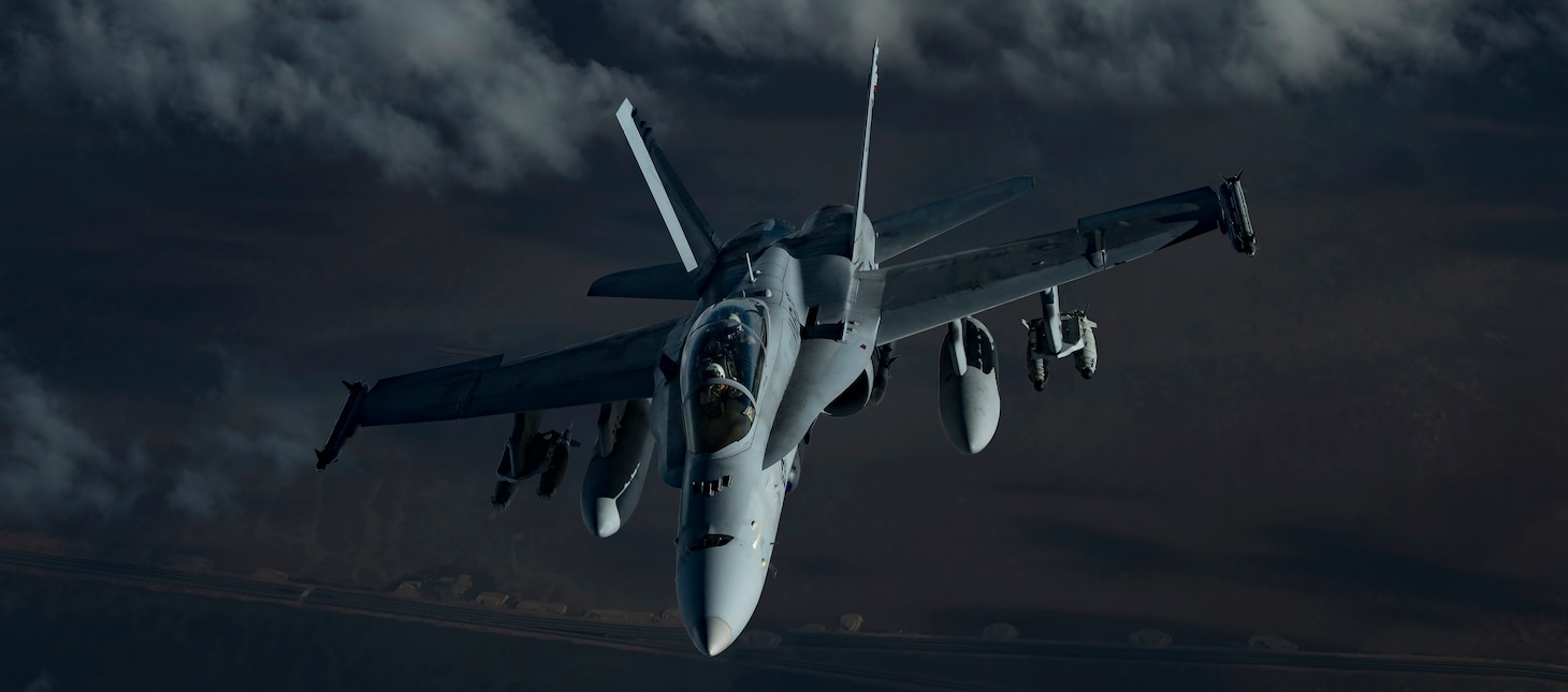 A U.S. Marine Corps F/A-18 Hornet assigned to Marine Fighter Attack Squadron (VMFA) 251 flies above the U.S. Central Command area of responsibility, Jan. 17, 2020. F/A-18s can be configured quickly to perform either fighter or attack roles through use of external equipment to accomplish specific missions. This capability gives operational commanders more flexibility in employing tactical aircraft in a rapidly changing battle scenario. (U.S. Air Force photo by Staff Sgt. Daniel Snider)