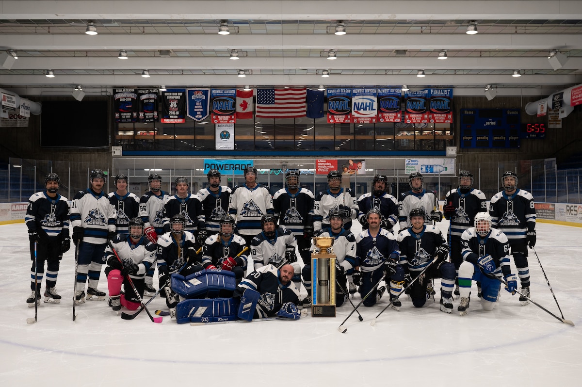 Members of the Eielson Icemen hockey team pose for a group photo in Fairbanks, Alaska, Nov. 26, 2023.