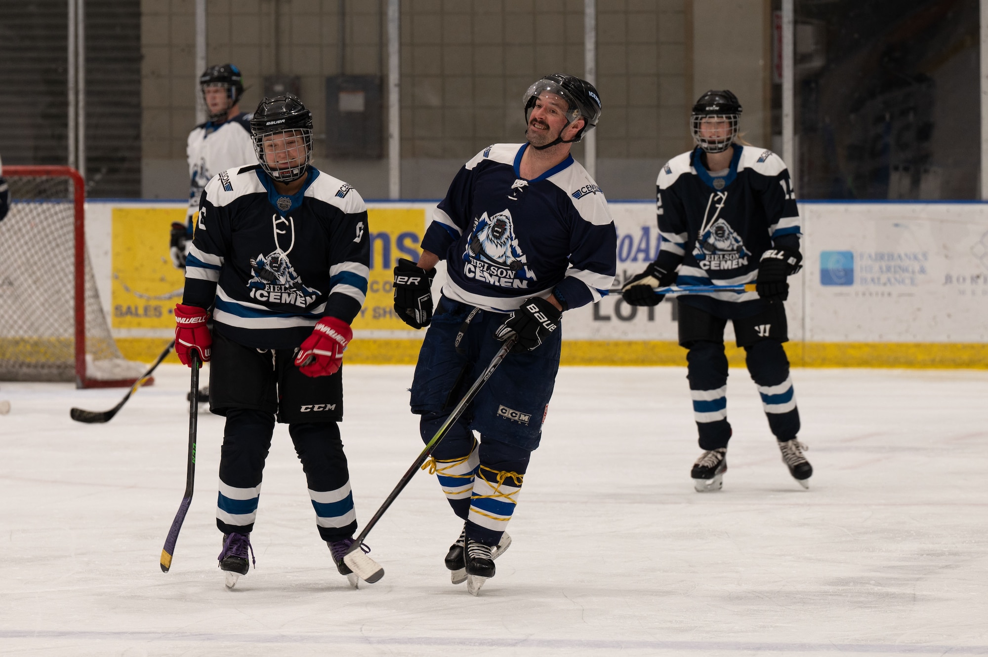 Members of the Eielson Icemen hockey team warm up before practice in Fairbanks, Alaska, Nov. 26, 2023.