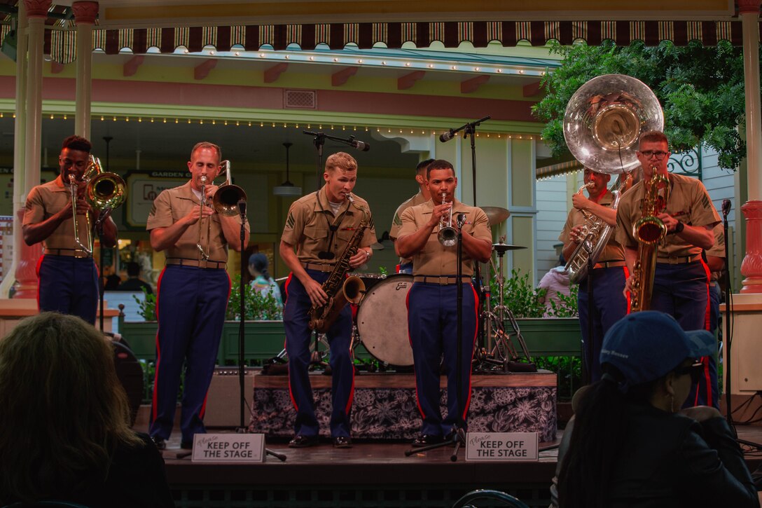 U.S. Marines with the 1st Marine Division Brass Band performs at Disneyland in Anaheim, California, July 3, 2023. The 1st MARDIV Band was featured in Disneyland’s Flag Parade and several other performances during the park’s annual Independence Day celebration. (U.S. Marine Corps photo by Cpl. Emeline Molla)