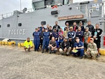 U.S. Coast Guard Forces Micronesia/Sector Guam personnel and 20 participants, including personnel from the FSM Maritime Wing, Fire and Rescue services, and Pohnpei Department of Public Safety take a moment for a photo in Pohnpei, from Dec. 4 to 7, 2023, in Pohnpei, Federated States of Micronesia (FSM) on Dec. 5, 2023. This exercise marks a continuation of efforts to bolster SAR capabilities in the region, highlighting the enduring partnership between the U.S. Coast Guard and its Pacific Island partners under the Compact of Free Association (COFA). (U.S. Coast Guard photo)