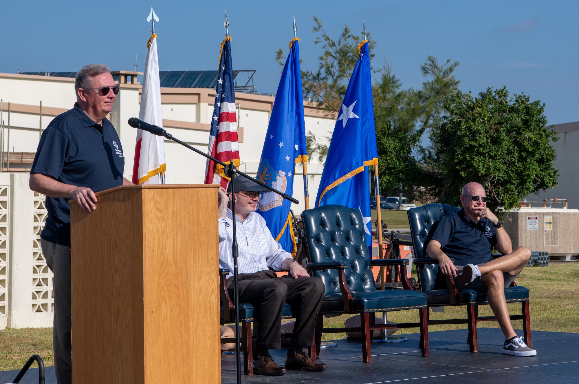 U.S. Air Force Lt. Gen. Ricky Rupp, recites the athlete's oath at a podium,