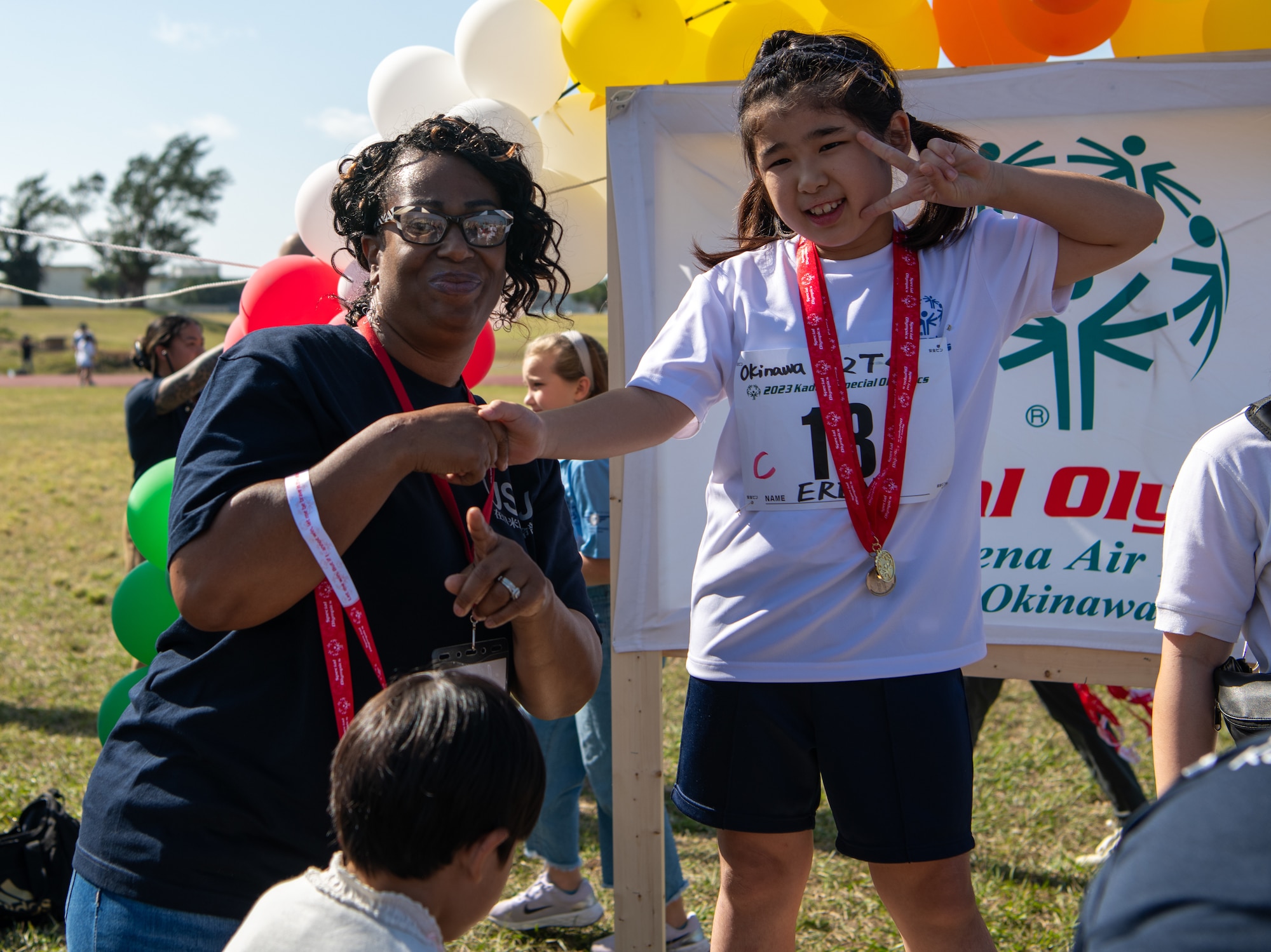 An athlete is awarded a medal.