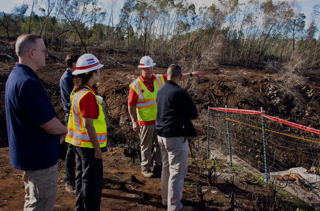 FCO Thomas Dargan and SCO Administrator James Barros visited Maui to view several aspects of the Hawaii Wildfires recovery mission, Dec. 8, 2023. Here Steve Lindamood, Senior Zone Manager, and Maria Delatorre, debris subject matter expert, speak about the debris removal operations in Kula.