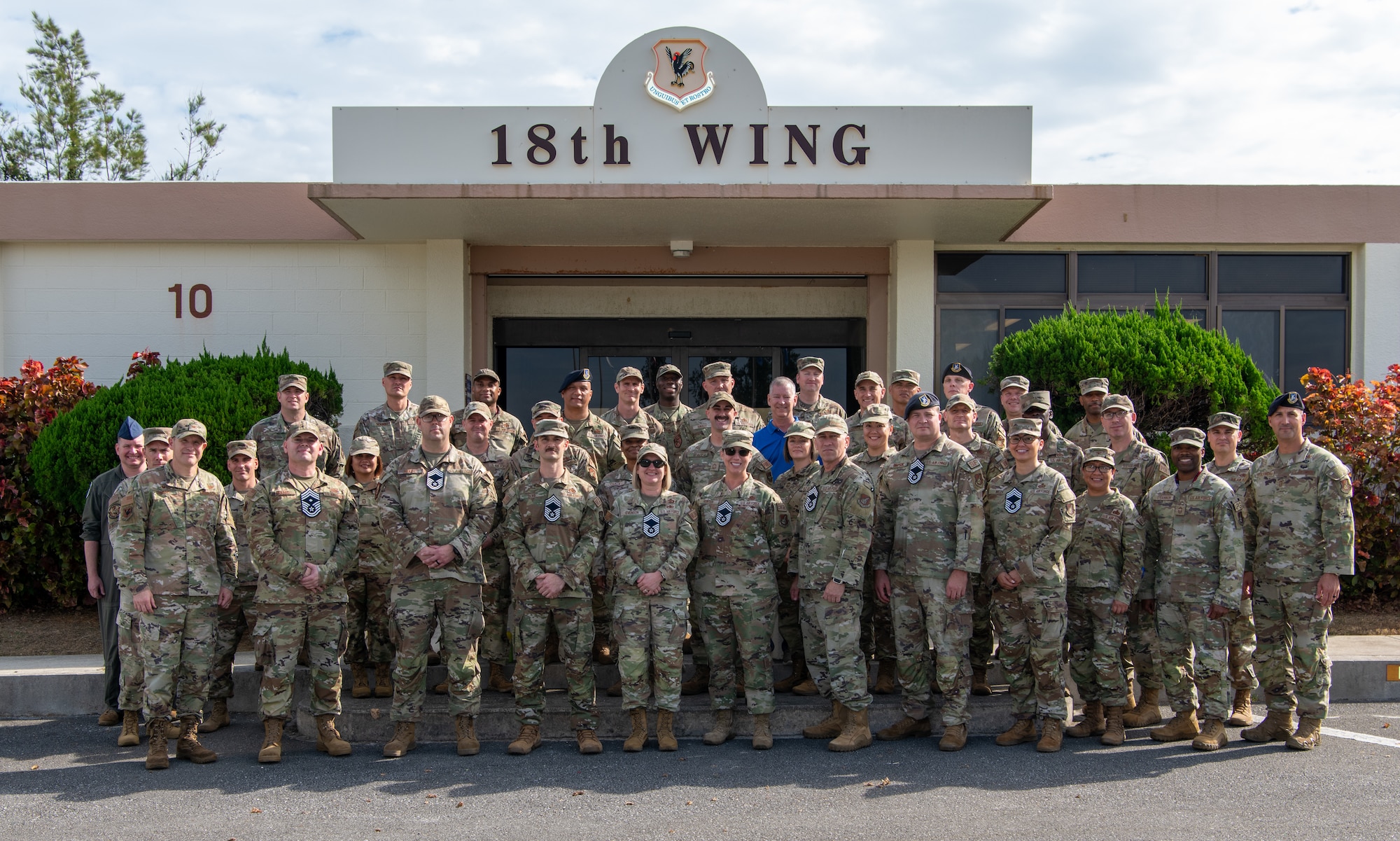 18th Wing leadership poses for a photo.
