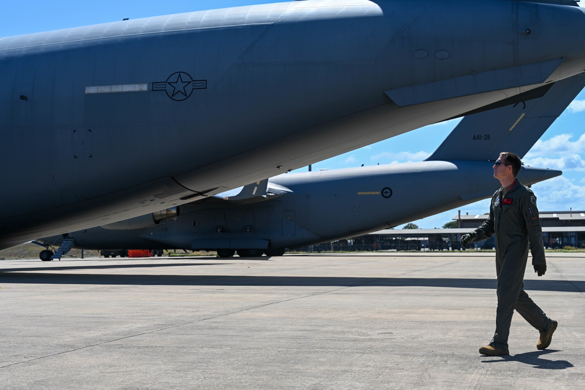 U.S. Air Force Col. Michael Lewis, 15th Operations Group commander, performs a preflight check around a C-17 Globemaster III during Exercise Global Dexterity 23-2 at Royal Australian Air Force Base Townsville, Dec. 6, 2023.  Exercise Global Dexterity prepares our air forces for combined action in wartime, peacetime and humanitarian operations throughout the Indo-Pacific. (U.S. Air Force photo by Senior Airman Makensie Cooper)