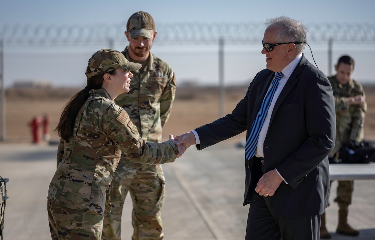 SECAF Frank Kendall coins Special Agent Jaimie Doney from the Office of Special Investigations Detachment 2417 in an undisclosed location in the CENTCOM area of responsibility