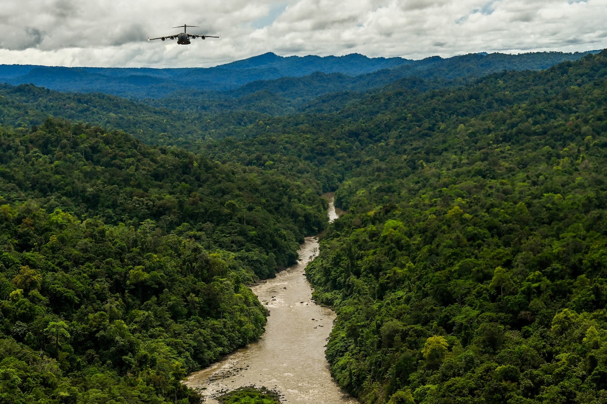 A Royal Australian Air Force C-17 Globemaster III flies in a training flight formation during Exercise Global Dexterity 23-24 around the skies of Papua New Guinea, Dec. 6, 2023.  Exercise Global Dexterity prepares our air forces for combined action in wartime, peacetime and humanitarian operations throughout the Indo-Pacific. (U.S. Air Force photo by Senior Airman Makensie Cooper)