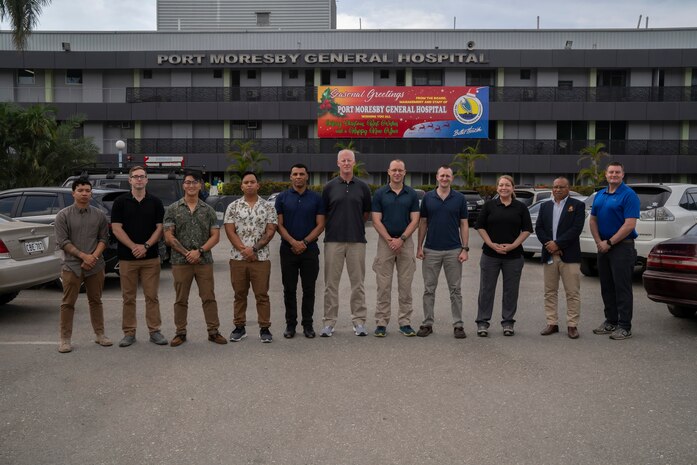 Members of the U.S. Army's 8th Forward Resuscitative and Surgical Detachment, 18th Medical Command, (2nd from the right) Port Moresby General Hospital Director of Medical Services Dr. Kone Sobi, and U.S. Army Maj. Levi Daugherty, trauma surgeon, Brooke Army Medical Center, pose for a group photo during the inaugural Papua New Guinea Trauma Rotation at Port Moresby General Hospital at Port Moresby, Papua New Guinea, Dec. 7, 2023. The Trauma Rotation follows the recent signing of the Defense Cooperation Agreement between the U.S. and Papua New Guinea; it is a first-of-its-kind engagement between the U.S. Army and Papua New Guinea, which mutually offers parties the a chance to exchange medical expertise and techniques in an austere environment. (U.S. Army photo by Sgt. 1st Class Timothy Hughes/Released)