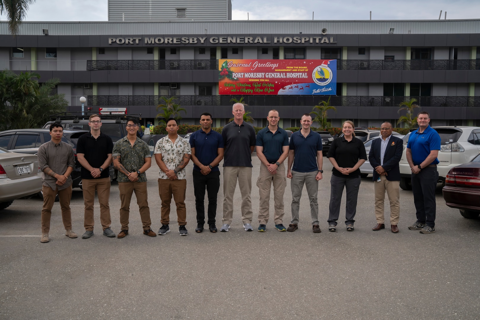 Members of the U.S. Army's 8th Forward Resuscitative and Surgical Detachment, 18th Medical Command, (2nd from the right) Port Moresby General Hospital Director of Medical Services Dr. Kone Sobi, and U.S. Army Maj. Levi Daugherty, trauma surgeon, Brooke Army Medical Center, pose for a group photo during the inaugural Papua New Guinea Trauma Rotation at Port Moresby General Hospital at Port Moresby, Papua New Guinea, Dec. 7, 2023. The Trauma Rotation follows the recent signing of the Defense Cooperation Agreement between the U.S. and Papua New Guinea; it is a first-of-its-kind engagement between the U.S. Army and Papua New Guinea, which mutually offers parties the a chance to exchange medical expertise and techniques in an austere environment. (U.S. Army photo by Sgt. 1st Class Timothy Hughes/Released)