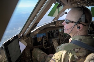 Brig. Gen. Salmi looks out the window during flight of a KC-46A Pegasus aircraft.