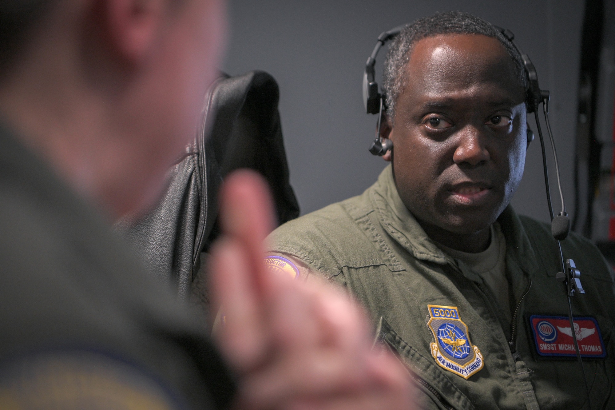 Senior Master Sgt. Thomas talks to other boom operator