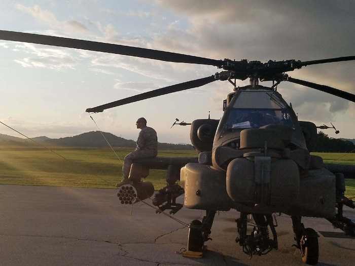 a man sits on a helicopter