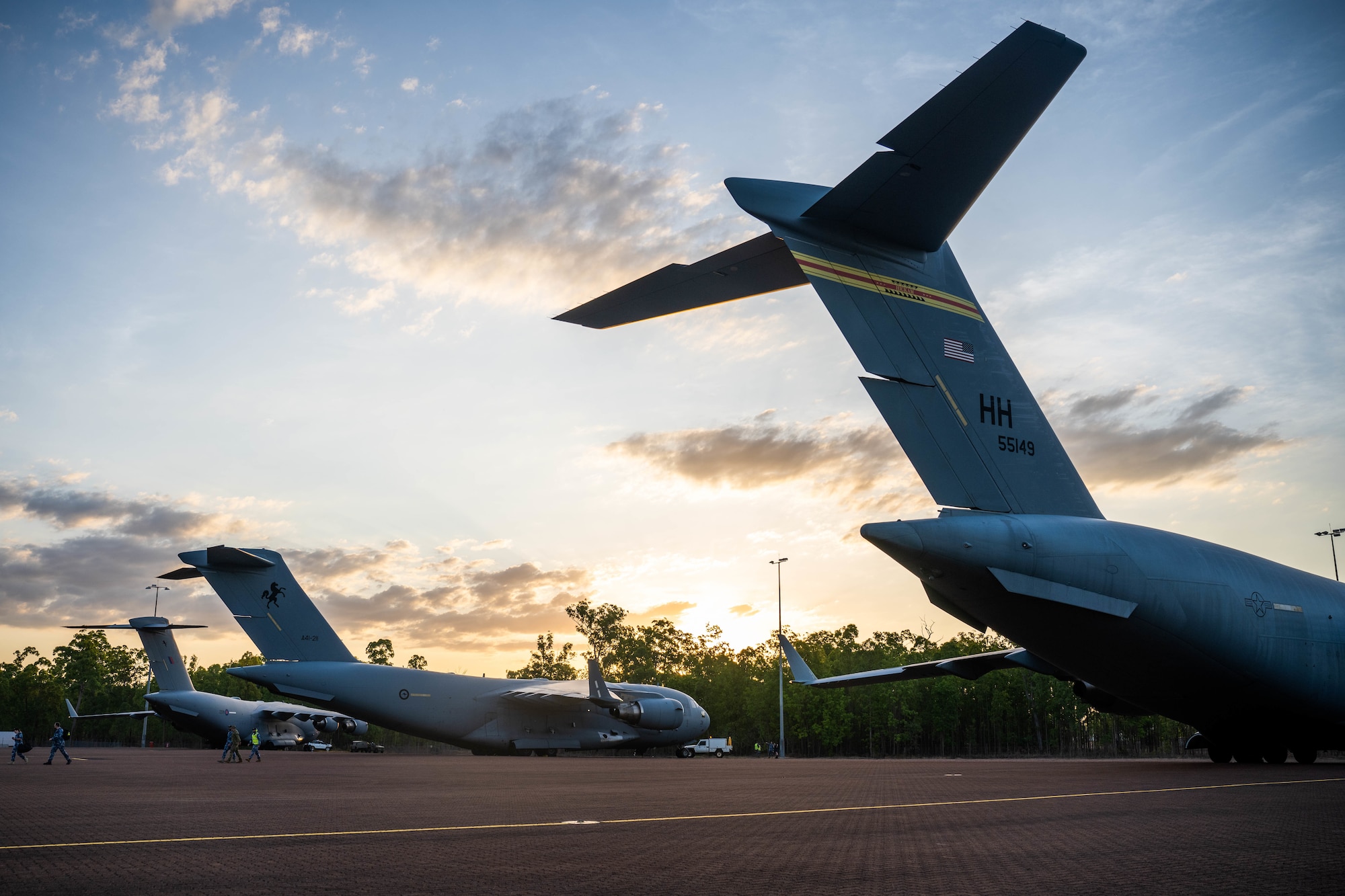 A U.S. Air Force, Royal Australian Air Force and Royal Air Force C-17 Globemaster III land at Royal Australian Air Force Base Scherger, Dec. 5, 2023 during Exercise Global Dexterity.  Exercise Global Dexterity prepares our air forces for combined action in wartime, peacetime and humanitarian operations throughout the Indo-Pacific. (U.S. Air Force photo by Senior Airman Makensie Cooper)