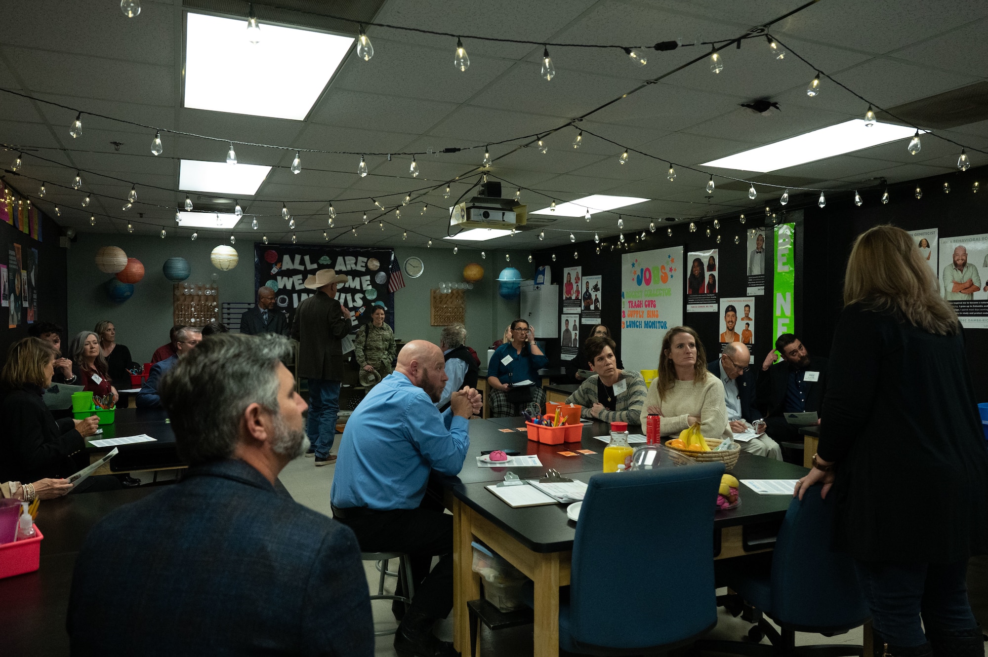 Civic leaders speak with members of the STARBASE program during a civic leader tour
