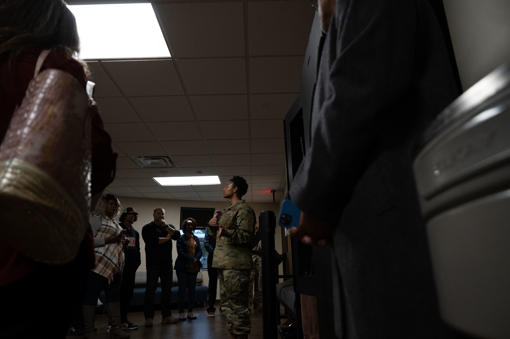 Cannon Air Force Base civic leaders receive a briefing from USAF Basic Military Training trainees about their dormitory