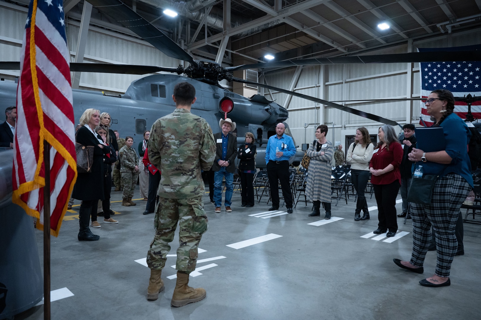 A U.S. Air Force Airman assigned to the 344th Training Squadron explains his technical school experience to civic leaders.